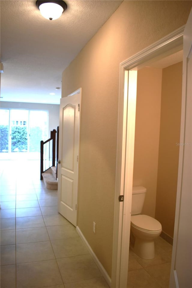 hallway with light tile patterned floors