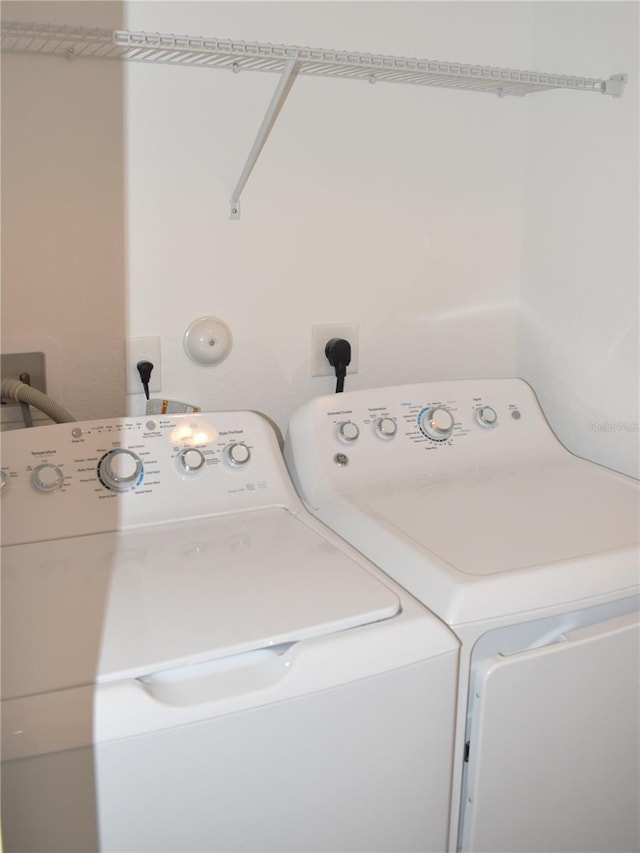 laundry area with washer and clothes dryer