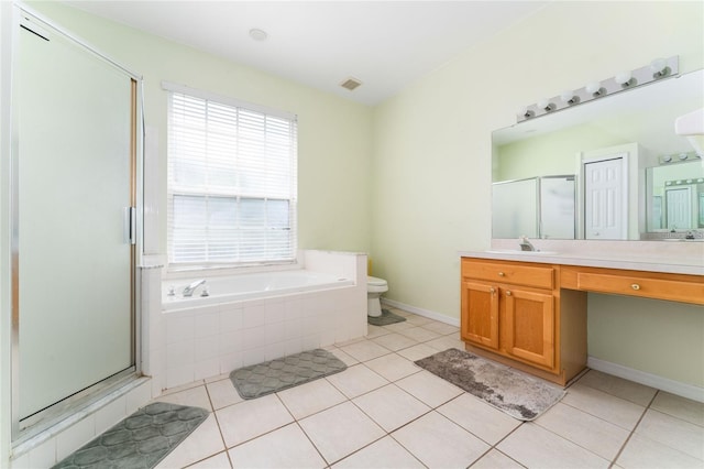 full bathroom with tile patterned flooring, plus walk in shower, vanity, and toilet