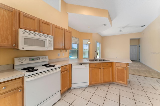 kitchen featuring white appliances, kitchen peninsula, ceiling fan, sink, and decorative light fixtures