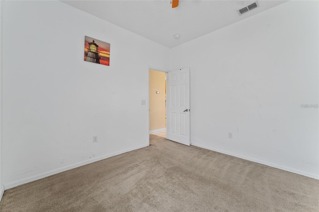 empty room featuring light colored carpet