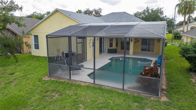 back of house with a lanai, a patio, a lawn, and central AC