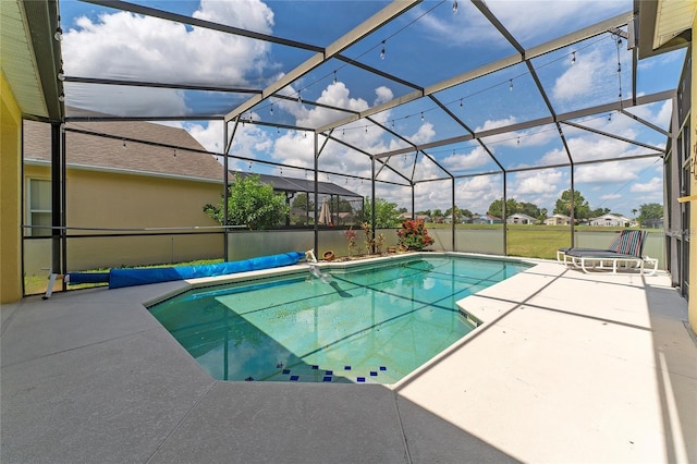 view of pool with a lanai and a patio area