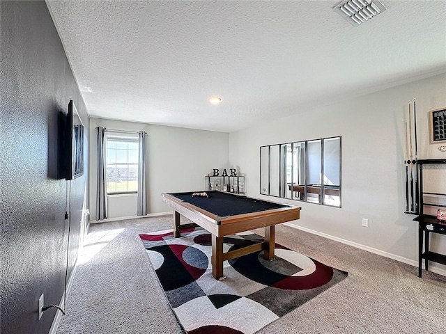 playroom featuring carpet flooring, pool table, and a textured ceiling