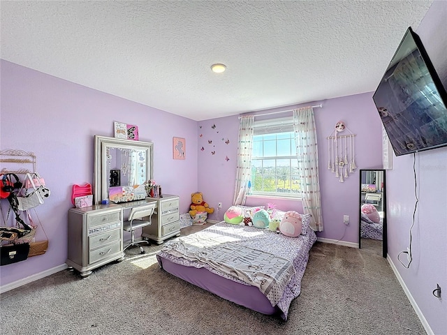 bedroom featuring carpet and a textured ceiling