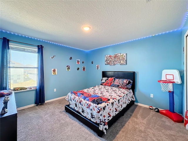 bedroom featuring carpet flooring and a textured ceiling