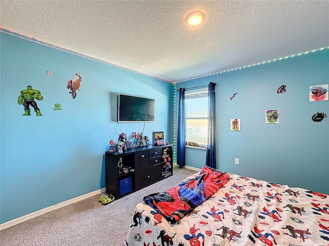 bedroom with a textured ceiling and carpet