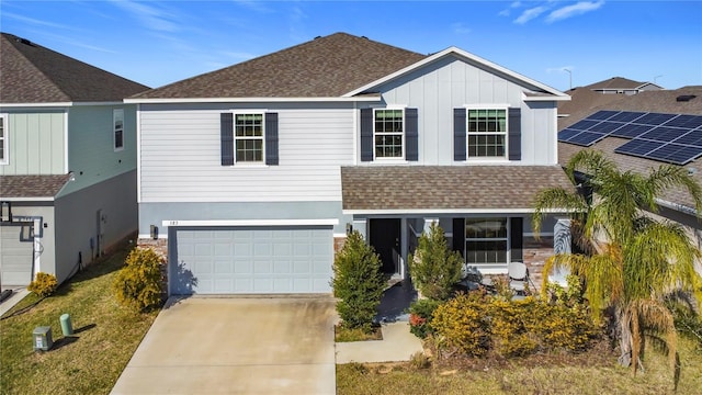 view of front of property with a garage