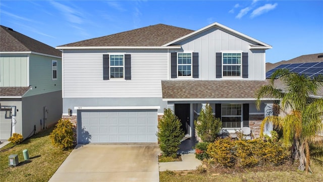 view of front of property with a garage