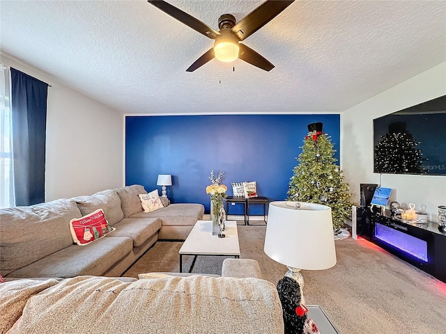 carpeted living room with ceiling fan and a textured ceiling