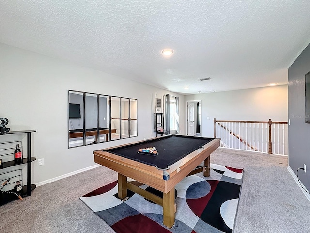 game room featuring pool table, a textured ceiling, and carpet