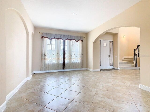 foyer entrance featuring light tile patterned flooring