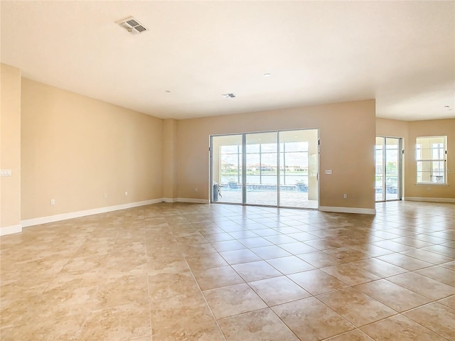 empty room featuring light tile patterned floors