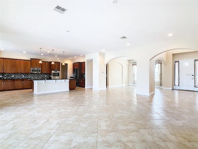 unfurnished living room with light tile patterned flooring