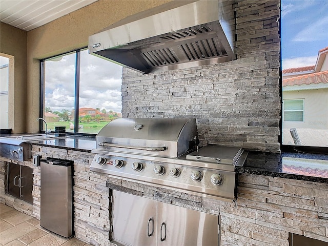 view of patio / terrace with grilling area and an outdoor kitchen