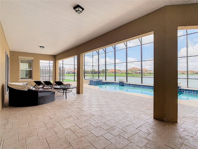 view of pool featuring a water view