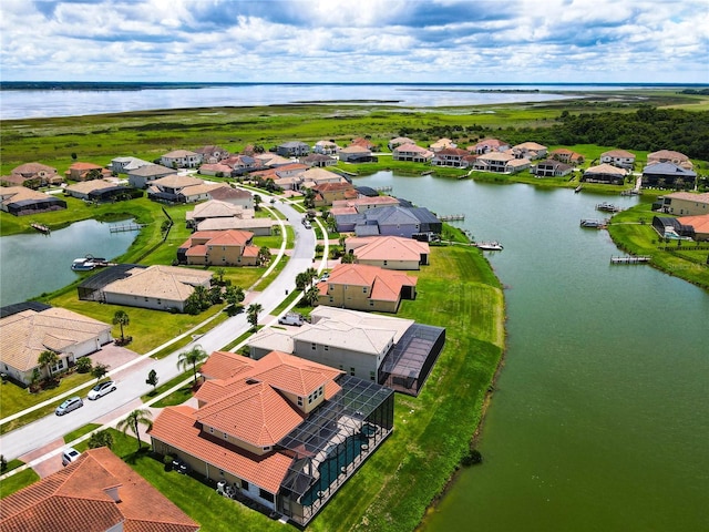 birds eye view of property with a water view