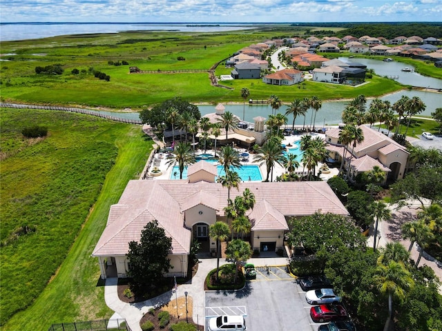 birds eye view of property with a water view