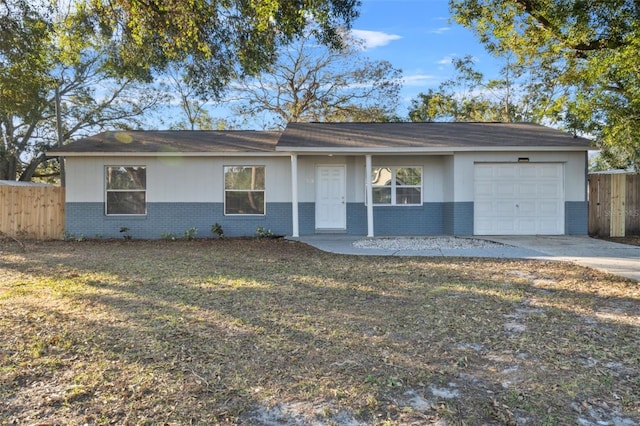 ranch-style house with a front lawn and a garage