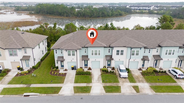 birds eye view of property featuring a water view