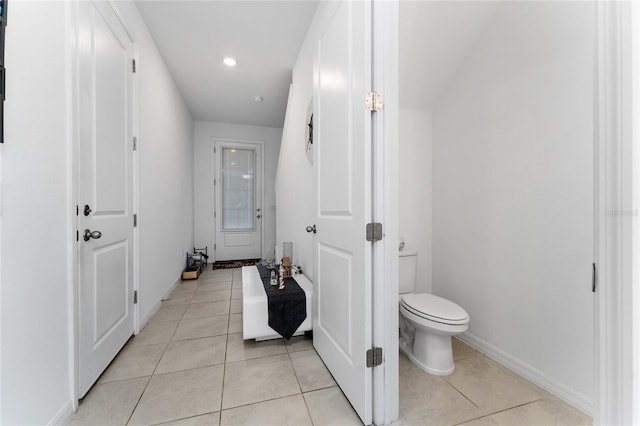 bathroom featuring toilet and tile patterned floors