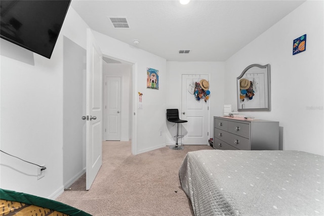 bedroom featuring light carpet