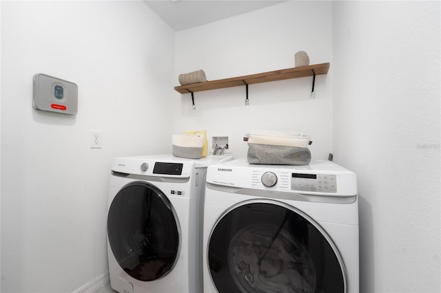 washroom with washing machine and dryer