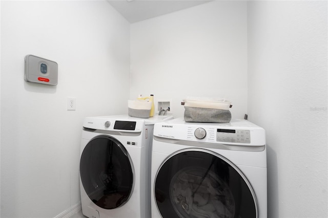 laundry area with washing machine and dryer