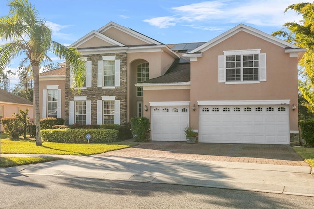 view of front of property with a garage