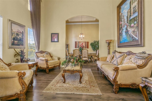 living area with a notable chandelier and dark hardwood / wood-style floors