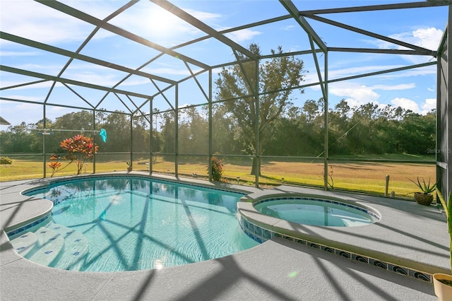 view of pool featuring an in ground hot tub, a lanai, and a patio area