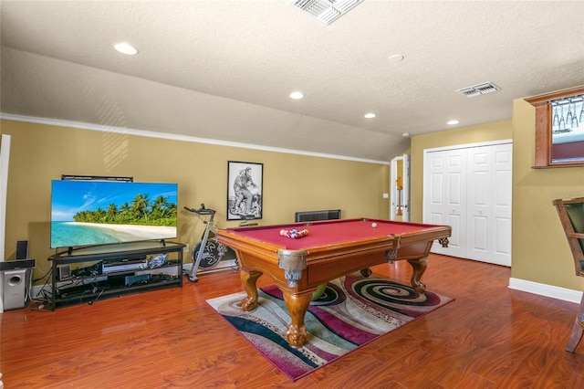 game room with hardwood / wood-style floors, ornamental molding, a textured ceiling, pool table, and vaulted ceiling