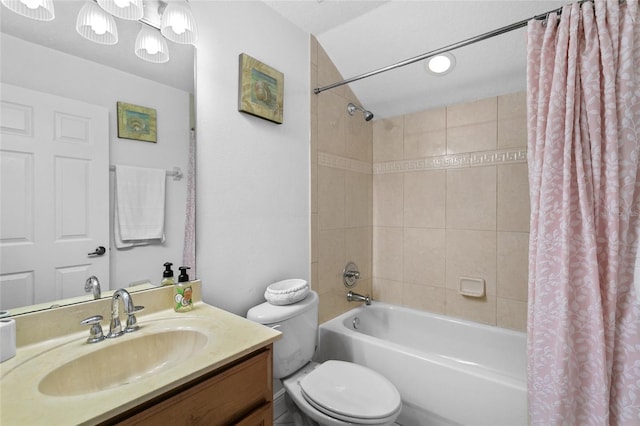 full bathroom with vanity, toilet, and shower / tub combo