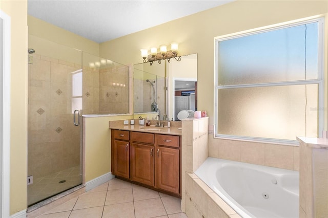 bathroom with vanity, tile patterned floors, and shower with separate bathtub