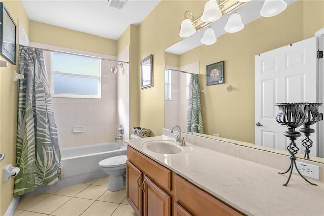 full bathroom with vanity, a notable chandelier, tile patterned floors, toilet, and shower / bath combo with shower curtain