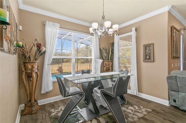 dining area featuring ornamental molding, dark hardwood / wood-style floors, and a notable chandelier