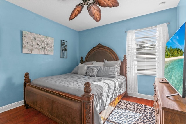 bedroom with ceiling fan and dark hardwood / wood-style flooring