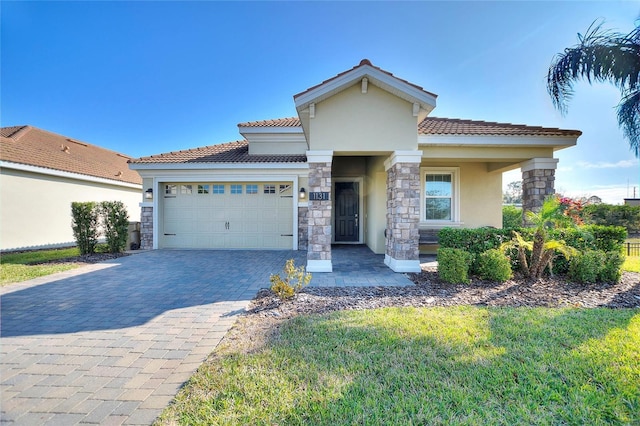 view of front of home with a garage