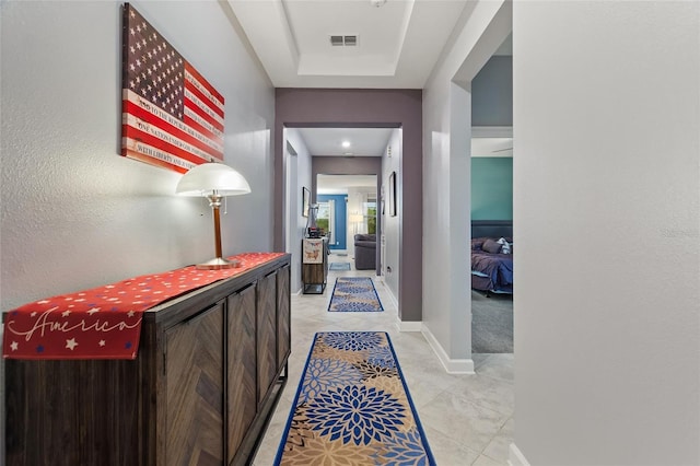 hall with light tile patterned flooring