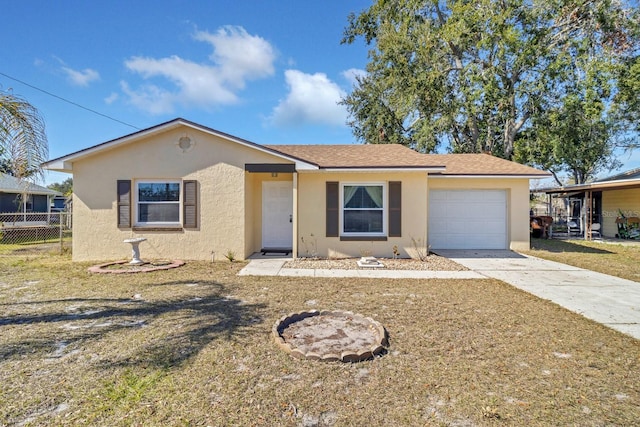 view of front of property featuring a garage and a front lawn