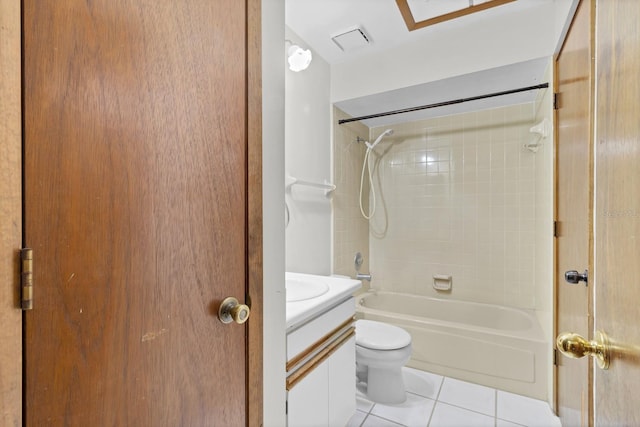 full bathroom with vanity, tiled shower / bath combo, tile patterned floors, and toilet