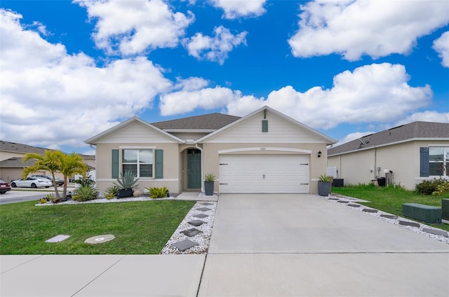 single story home featuring a front lawn and a garage