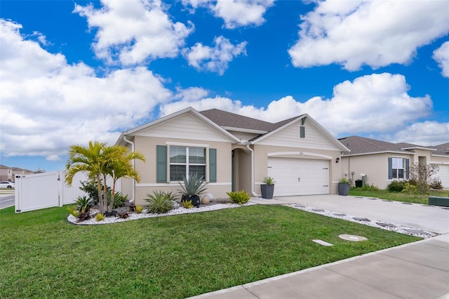 ranch-style house featuring a front lawn and a garage