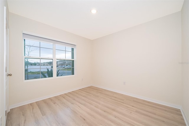 spare room featuring light hardwood / wood-style flooring