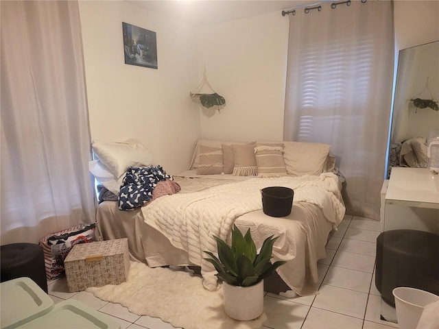 bedroom with light tile patterned flooring