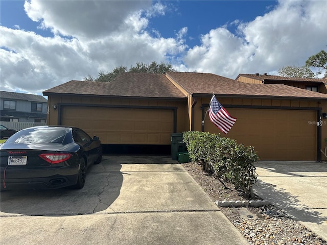 ranch-style house featuring a garage