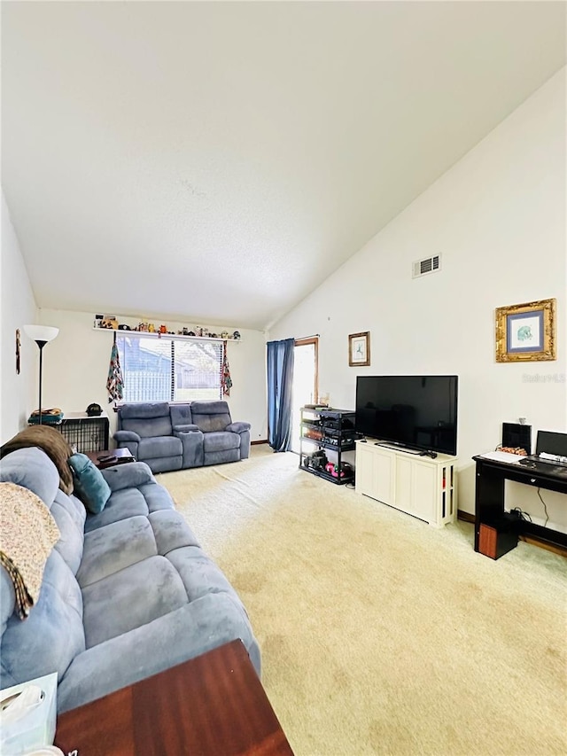 living room with carpet floors and lofted ceiling