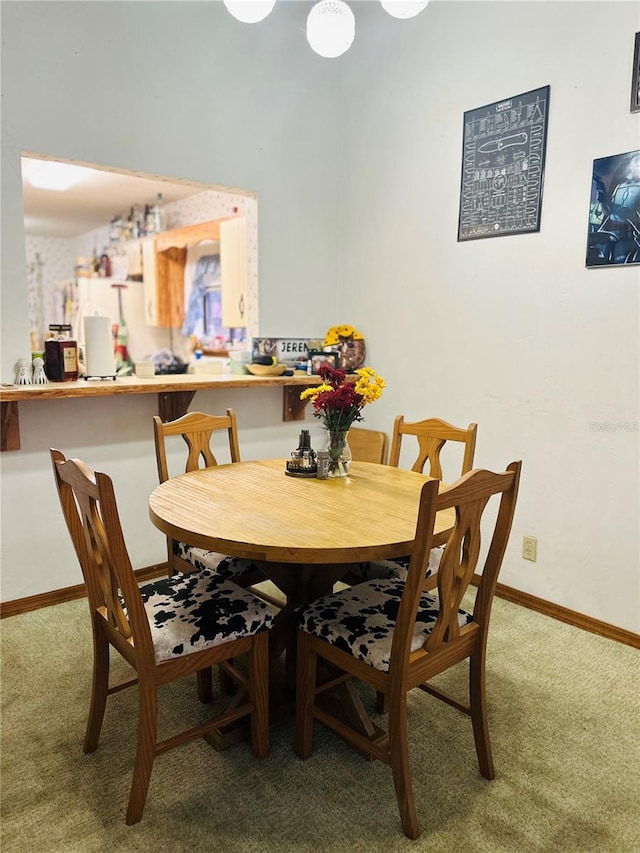 view of carpeted dining space