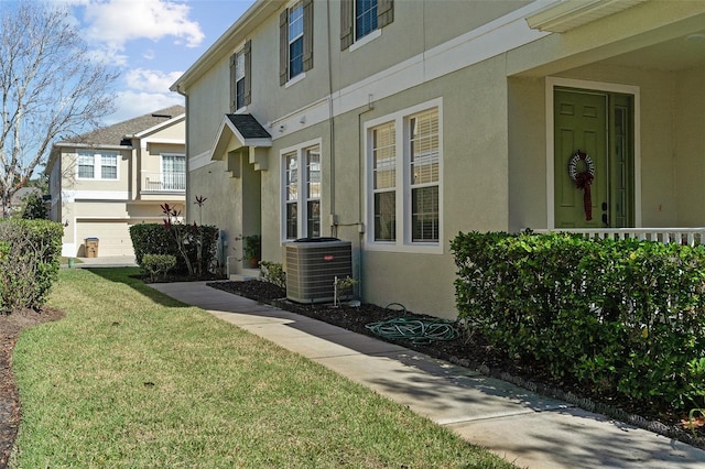 exterior space with a yard and cooling unit