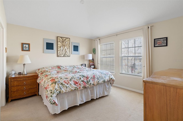 bedroom with light colored carpet